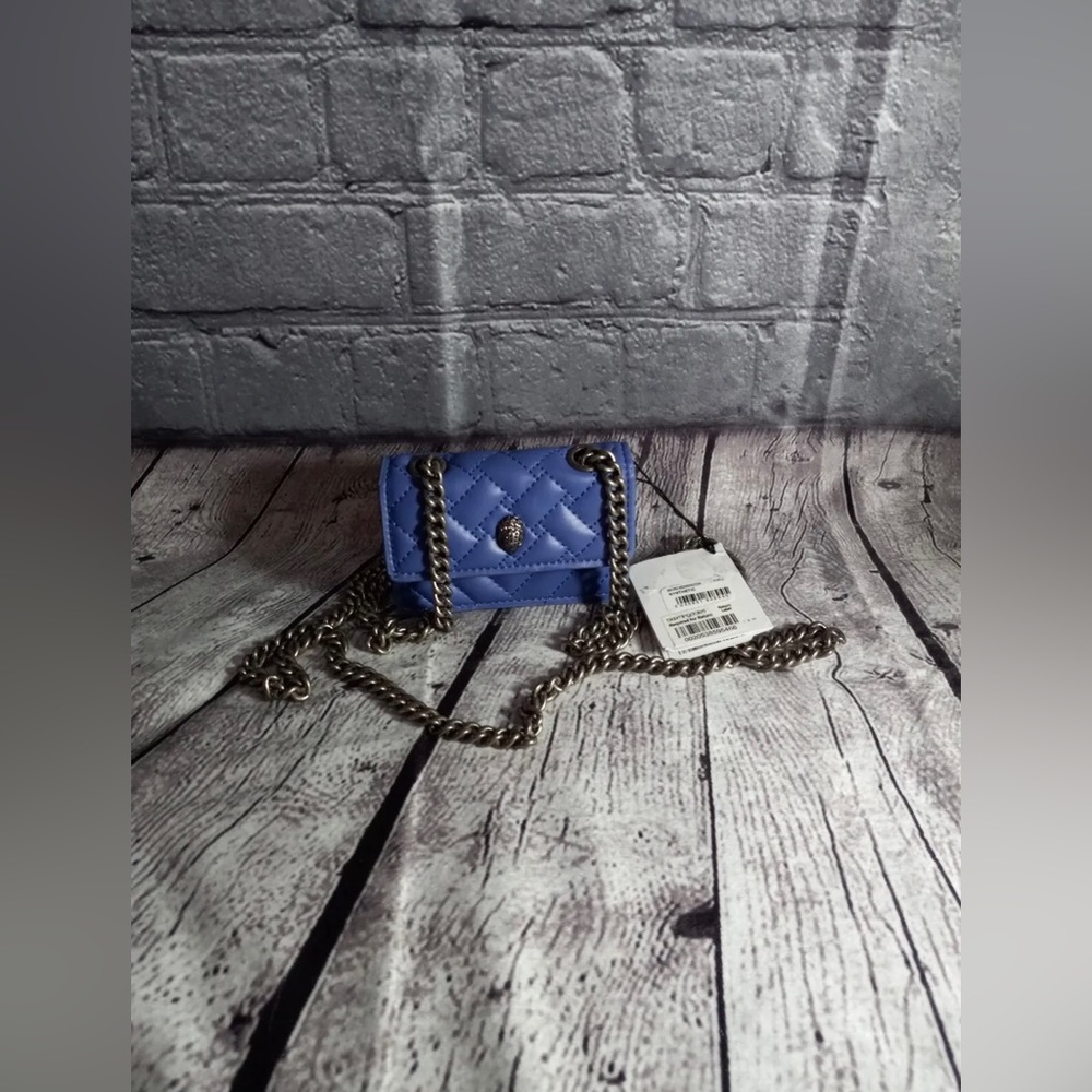 - Kurt Geiger London Micro Kensington Quilted Crossbody Bag
KURT GEIGER LO…